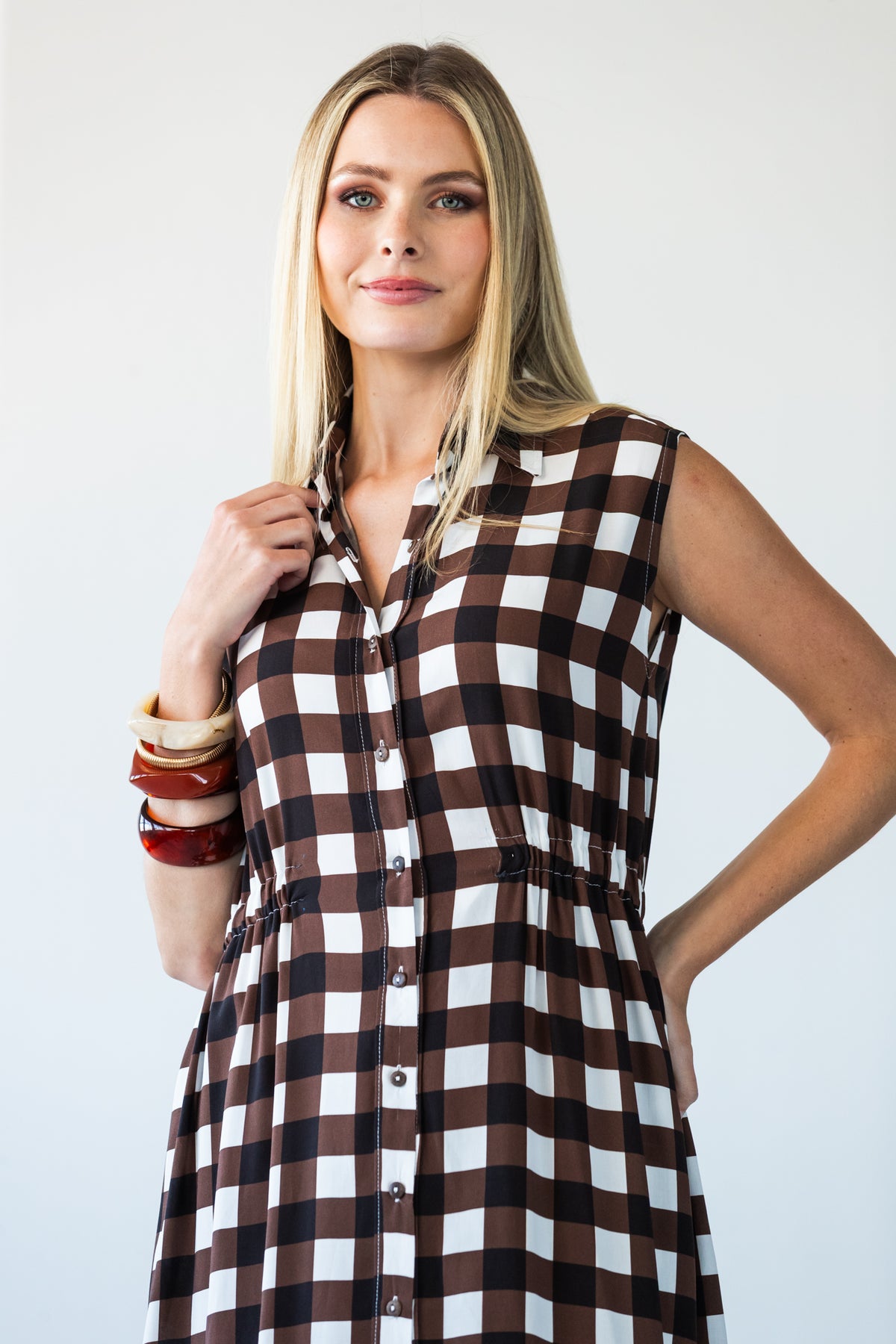 Sutton chocolate check shirt-dress, front view with hand at collar showing elasticated waist