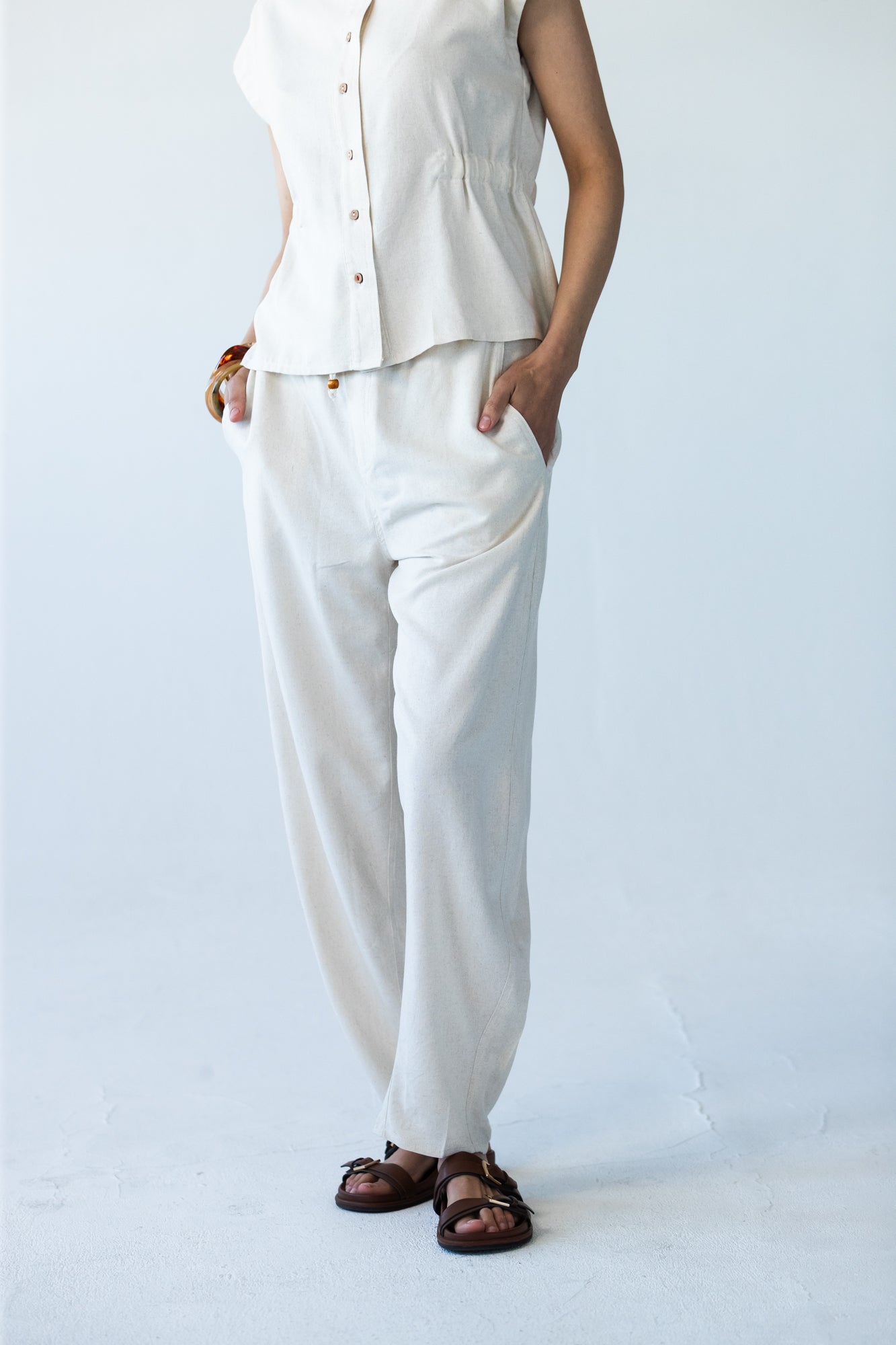 Parker stone barrel pants, close up front view with hands in pockets