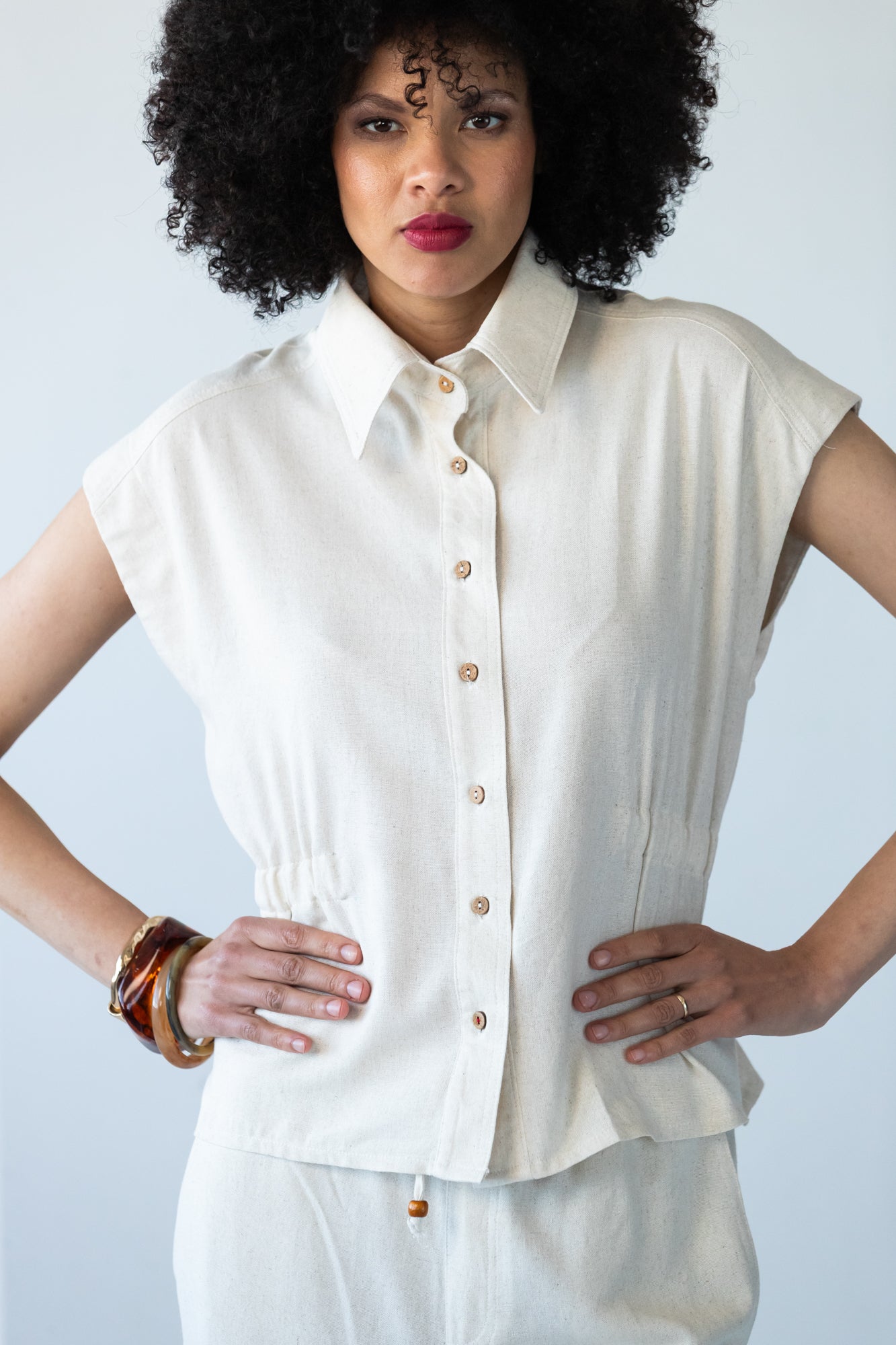 Reese stone shirt, close up of collar with hand at neckline