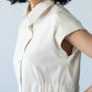 Reese stone shirt, side profile view with hand at hip