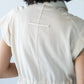 Reese stone shirt, close up of back loop tab detail