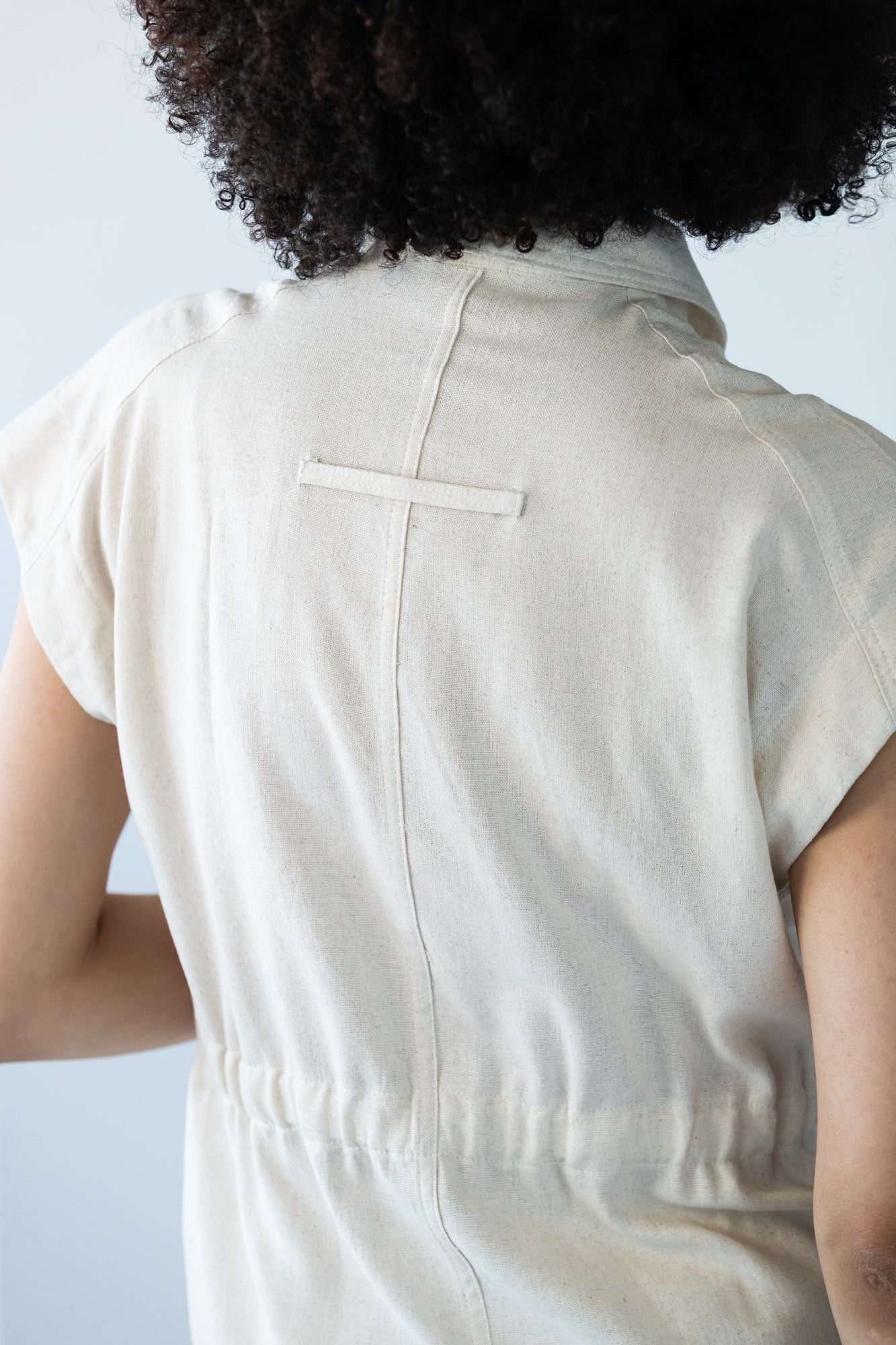 Reese stone shirt, close up of back loop tab detail