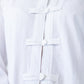 Kinsley white kaftan-style shirt, close up detail of frog fastening