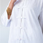 Kinsley white kaftan-style shirt, close up of collar and frog fastening