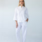 Parker white barrel pants, front view standing styled with white top