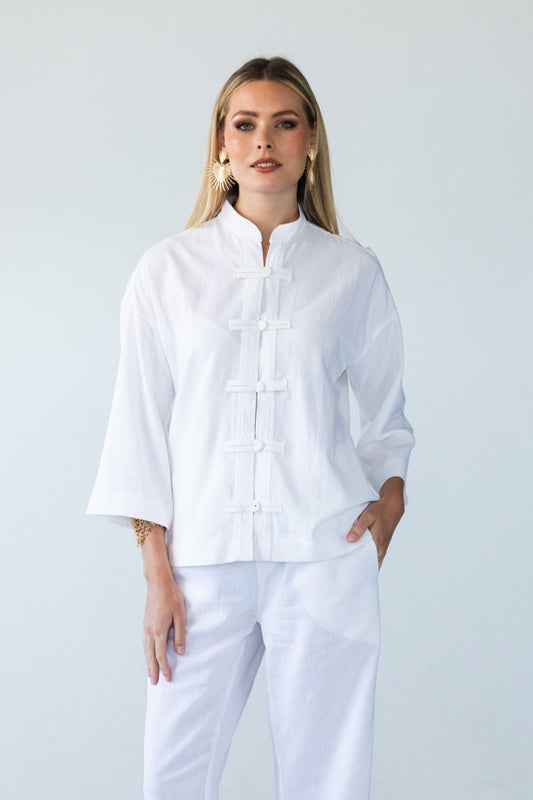 Kinsley white kaftan-style shirt, front view styled with Parker pants