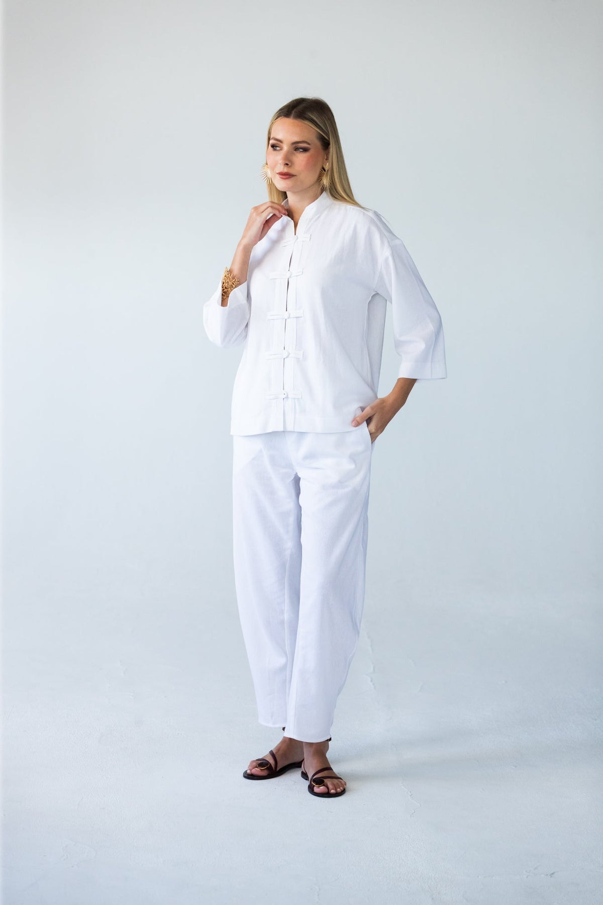 Kinsley white kaftan-style shirt, front view full length styled with Parker pants