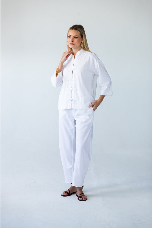 Kinsley white kaftan-style shirt, front view full length styled with Parker pants