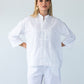 Kinsley white kaftan-style shirt, front view with hands on hips