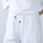 Parker white barrel pants, close up of waistband, drawcord and toggle
