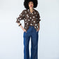 Blair wide leg denim pants, front view styled with polka dot shirt