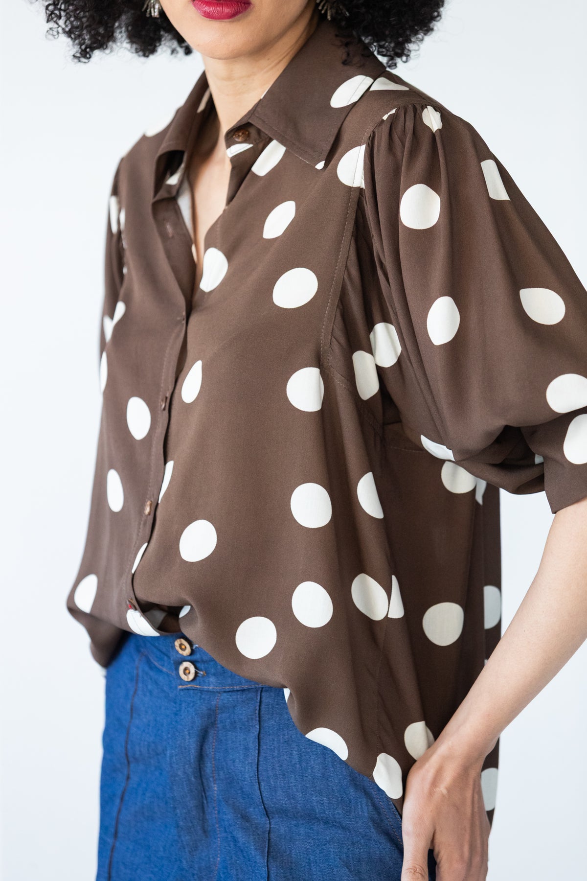Harper polka dot shirt, three-quarter view showing shoulder seam and balloon sleeve