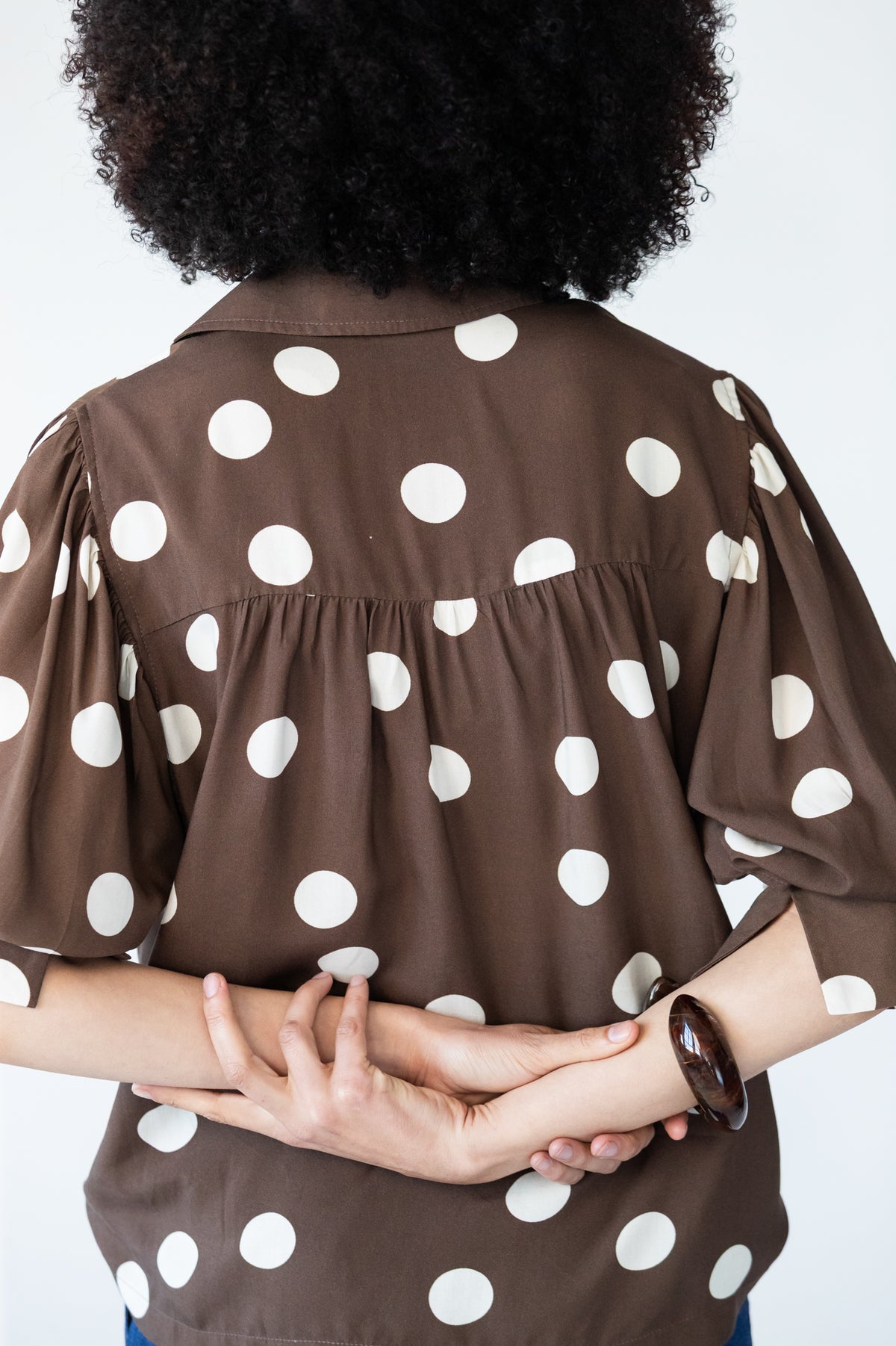Harper polka dot shirt, back view showing yoke and gathered back