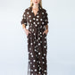 Sloane chocolate and cream polka dot dress, front view with belt
