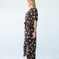 Sloane polka dot dress, side profile showing belt and side slit