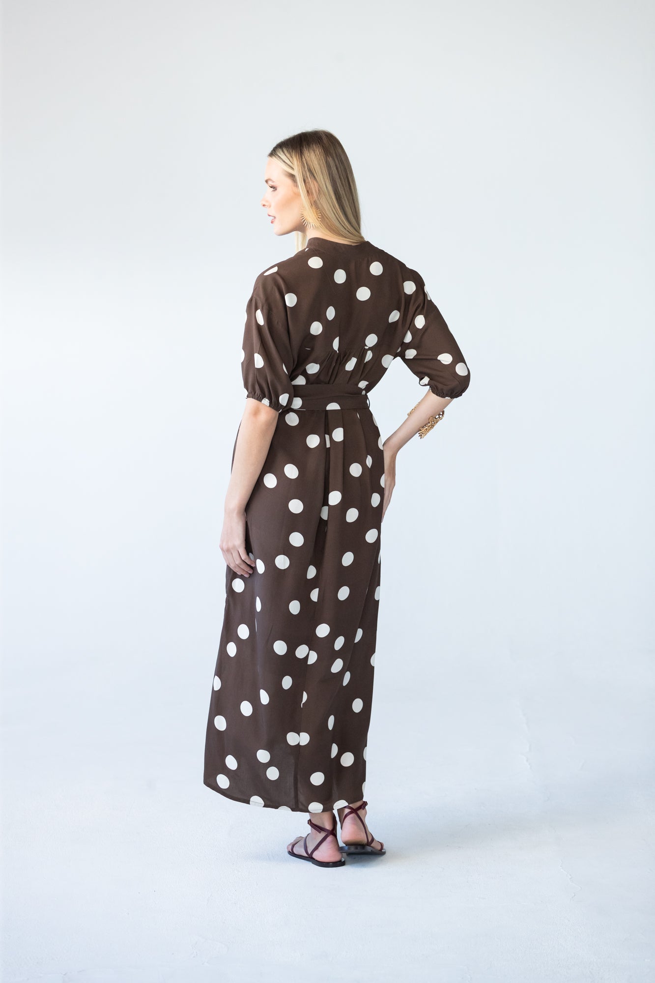 Sloane polka dot dress, side back view showing belt tie
