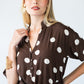 Sloane polka dot dress, close up of collar with hand at neckline