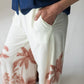 Sydney palm border wide leg pants, close up of waistband with hand in pocket