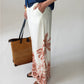 Sydney palm border wide leg pants, close up side view showing palm print