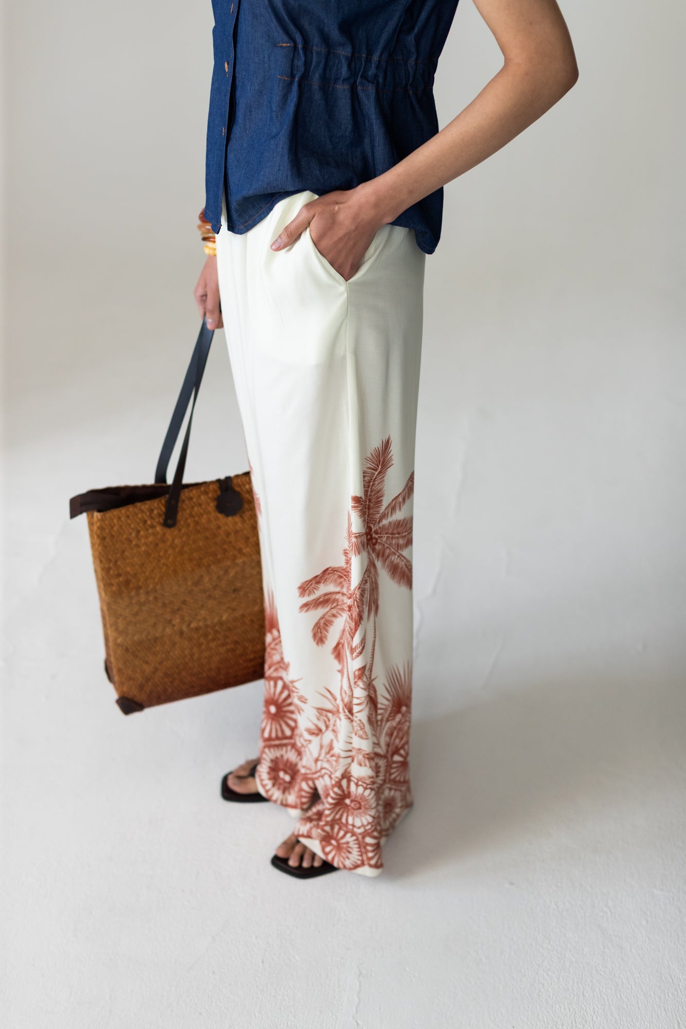 Sydney palm border wide leg pants, close up side view showing palm print