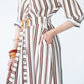 Cassidy stripe dress, close up view with hand in pocket