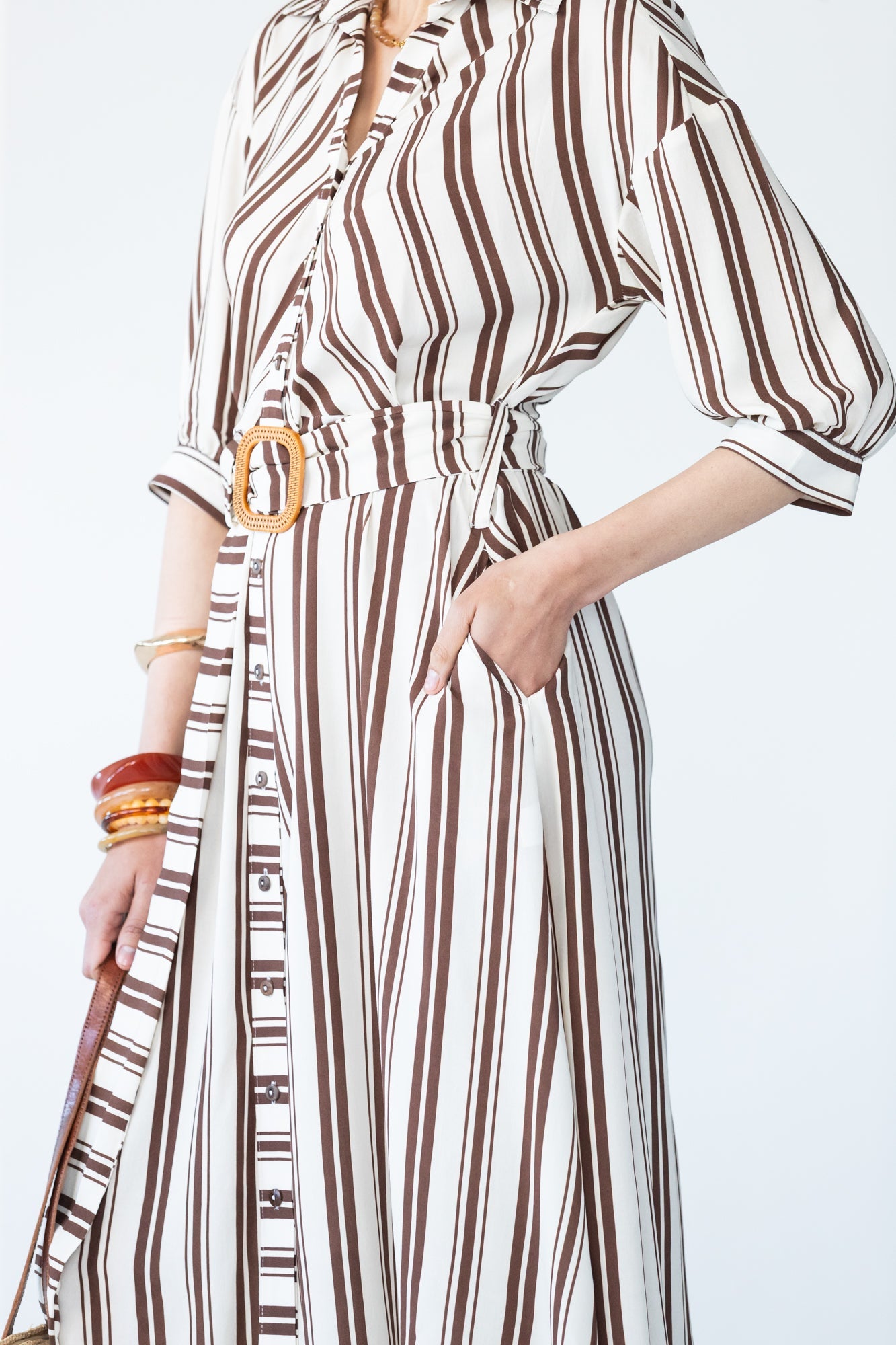 Cassidy stripe dress, close up view with hand in pocket