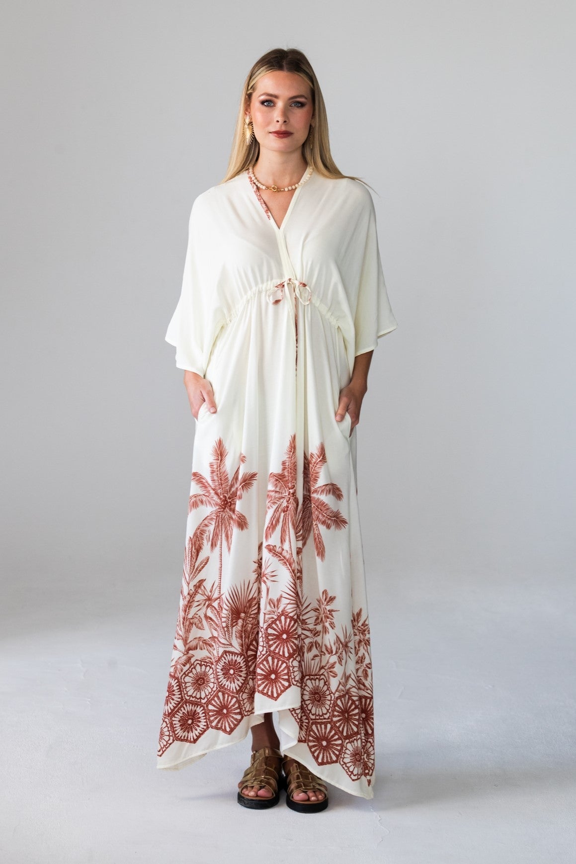 Georgia cream kaftan with rust palm border print, front view