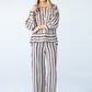 Sydney chocolate stripe wide leg pants, front view with arms crossed