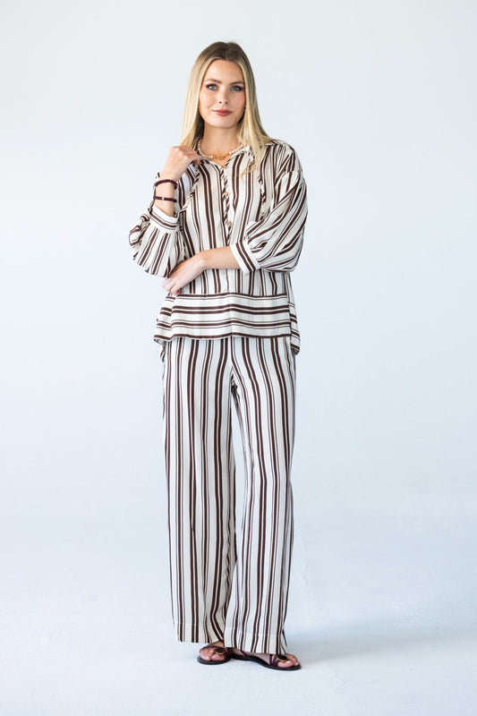 Sydney chocolate stripe wide leg pants, front view with arms crossed