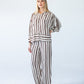 Sydney chocolate stripe wide leg pants, front view with hand on hip
