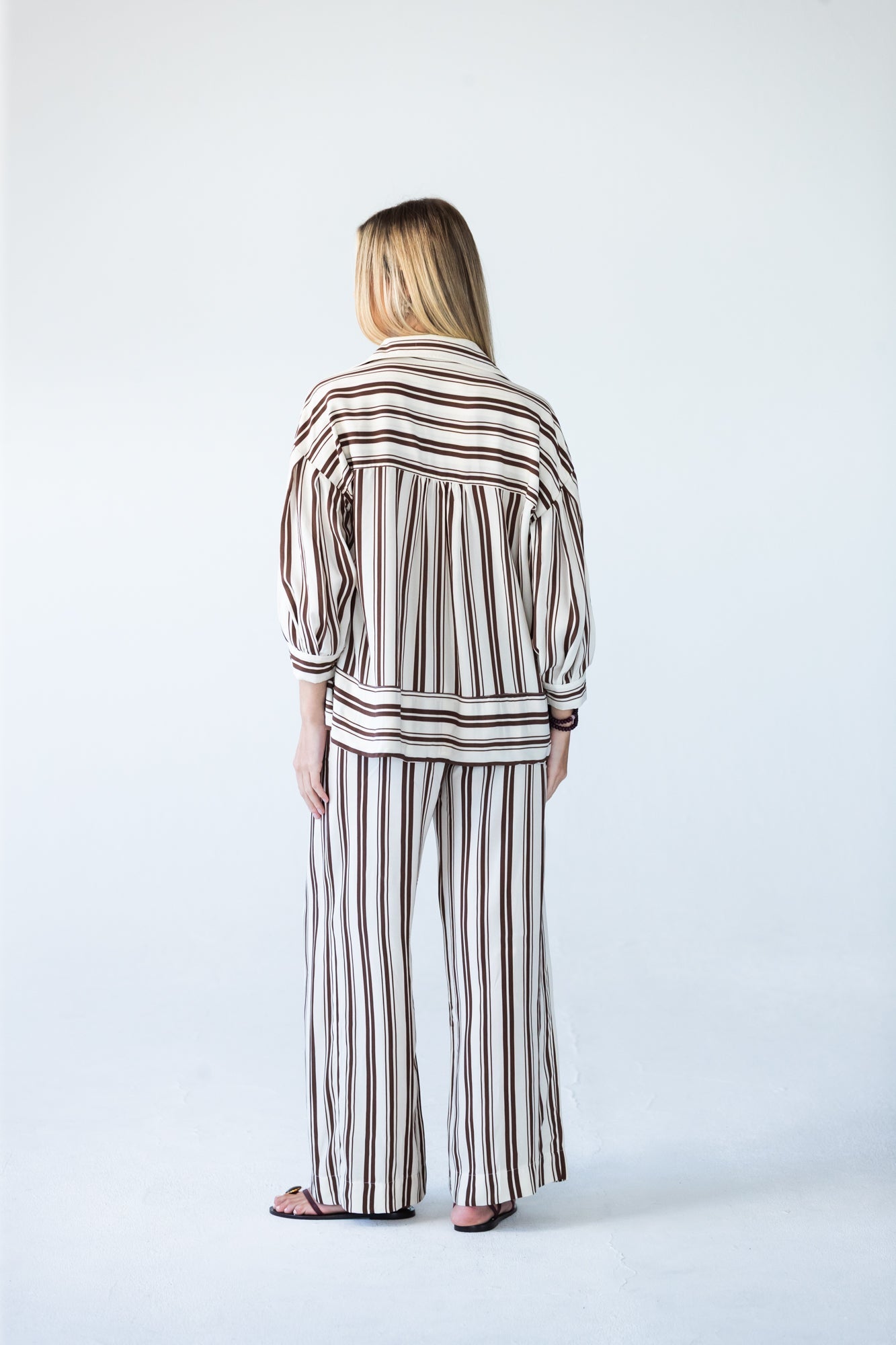 Blake chocolate stripe shirt, back view full length