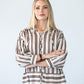 Blake chocolate stripe shirt, front view with arms crossed
