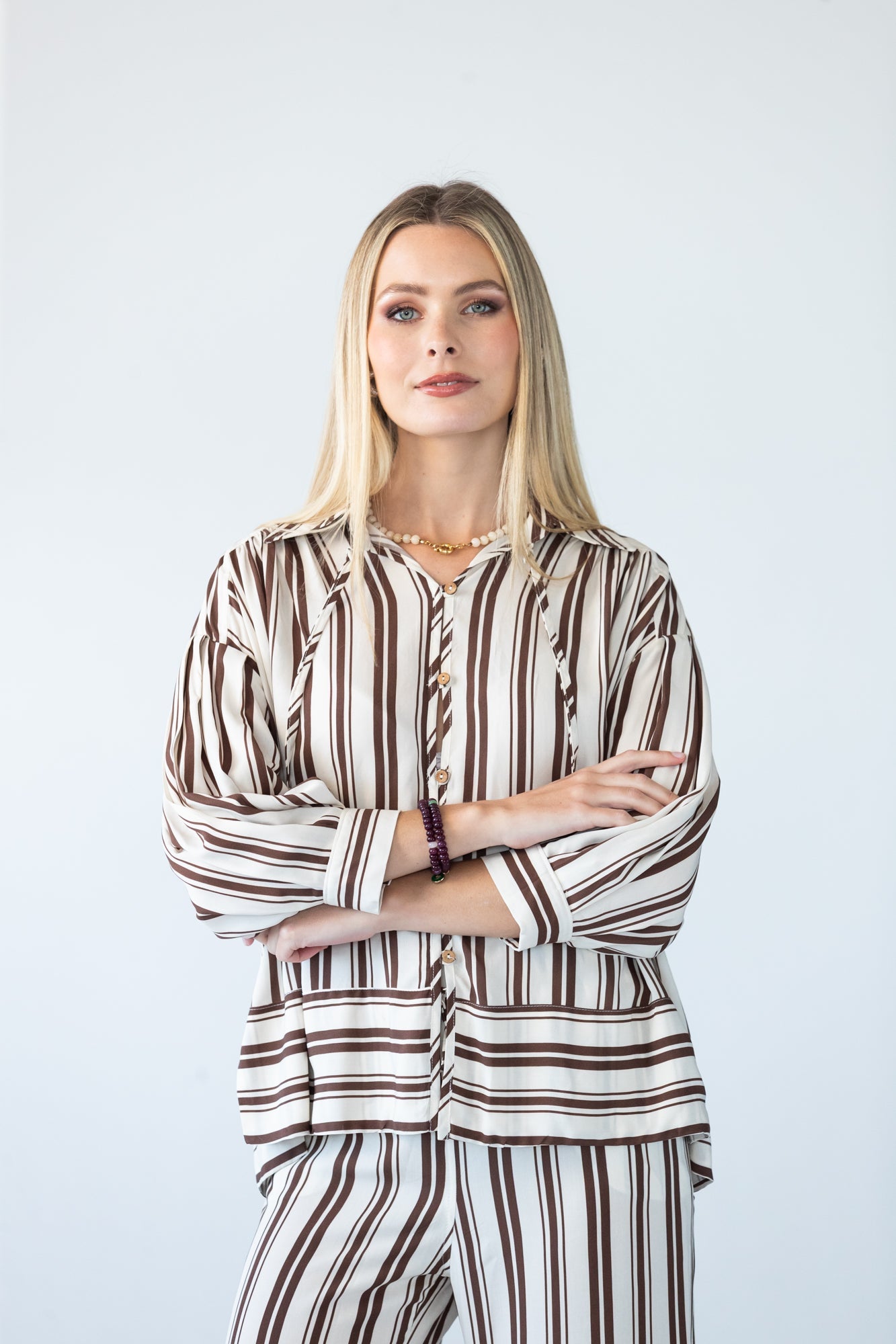 Blake chocolate stripe shirt, front view with arms crossed