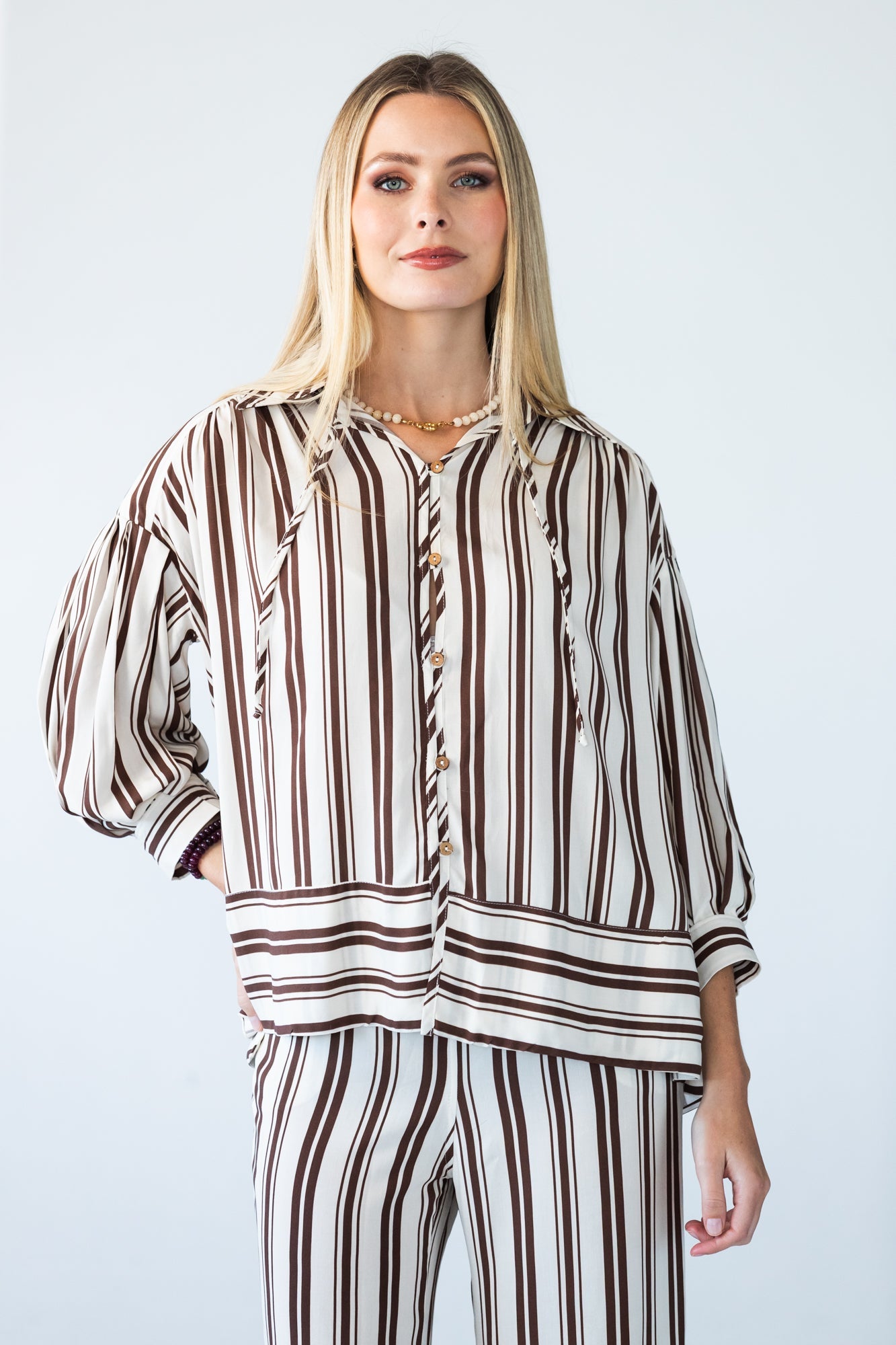 Blake chocolate stripe shirt, front view with hand at collar