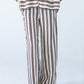 Sydney chocolate stripe wide leg pants, close up back view with hand in pocket