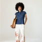 Reese denim shirt, front view styled with palm print wide-leg trousers