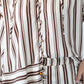 Blake chocolate stripe shirt, close up of placket and horizontal hem stripe