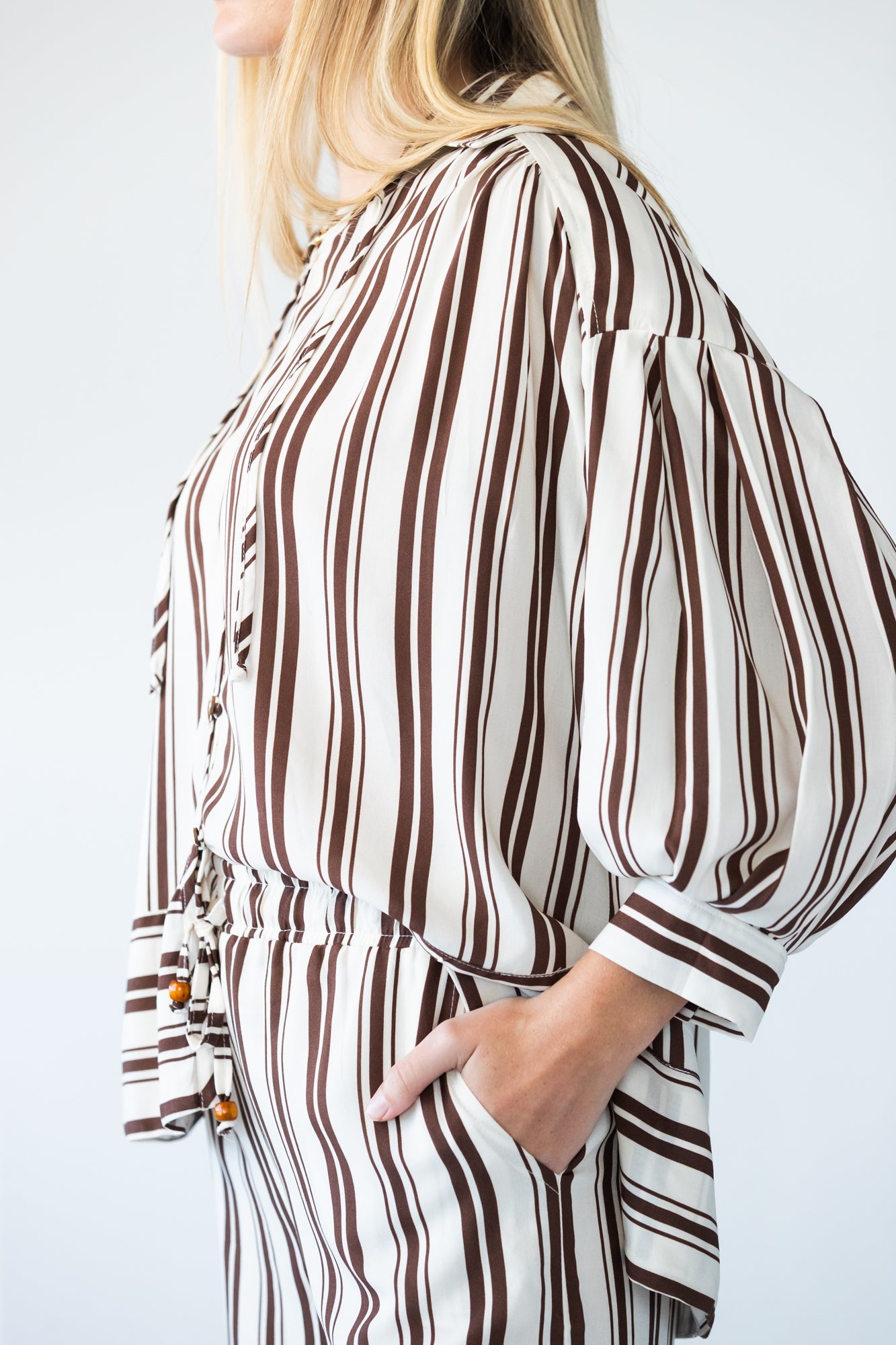 Blake chocolate stripe shirt, side view with hand in pocket