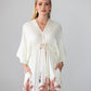 Georgia cream palm print kaftan, close up of neckline with hand at chest