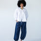 Blake white poplin shirt, front view styled with balloon pants and red shoes