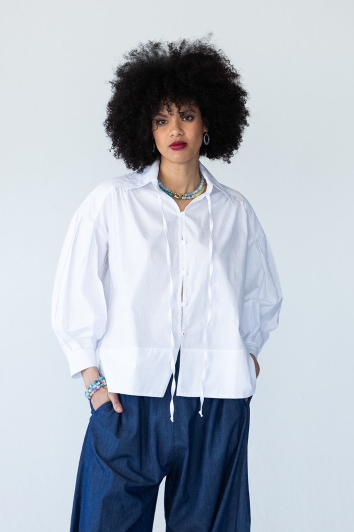 Blake white poplin shirt, front view styled with denim balloon pants