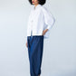 Blake white poplin shirt, side profile view styled with balloon pants