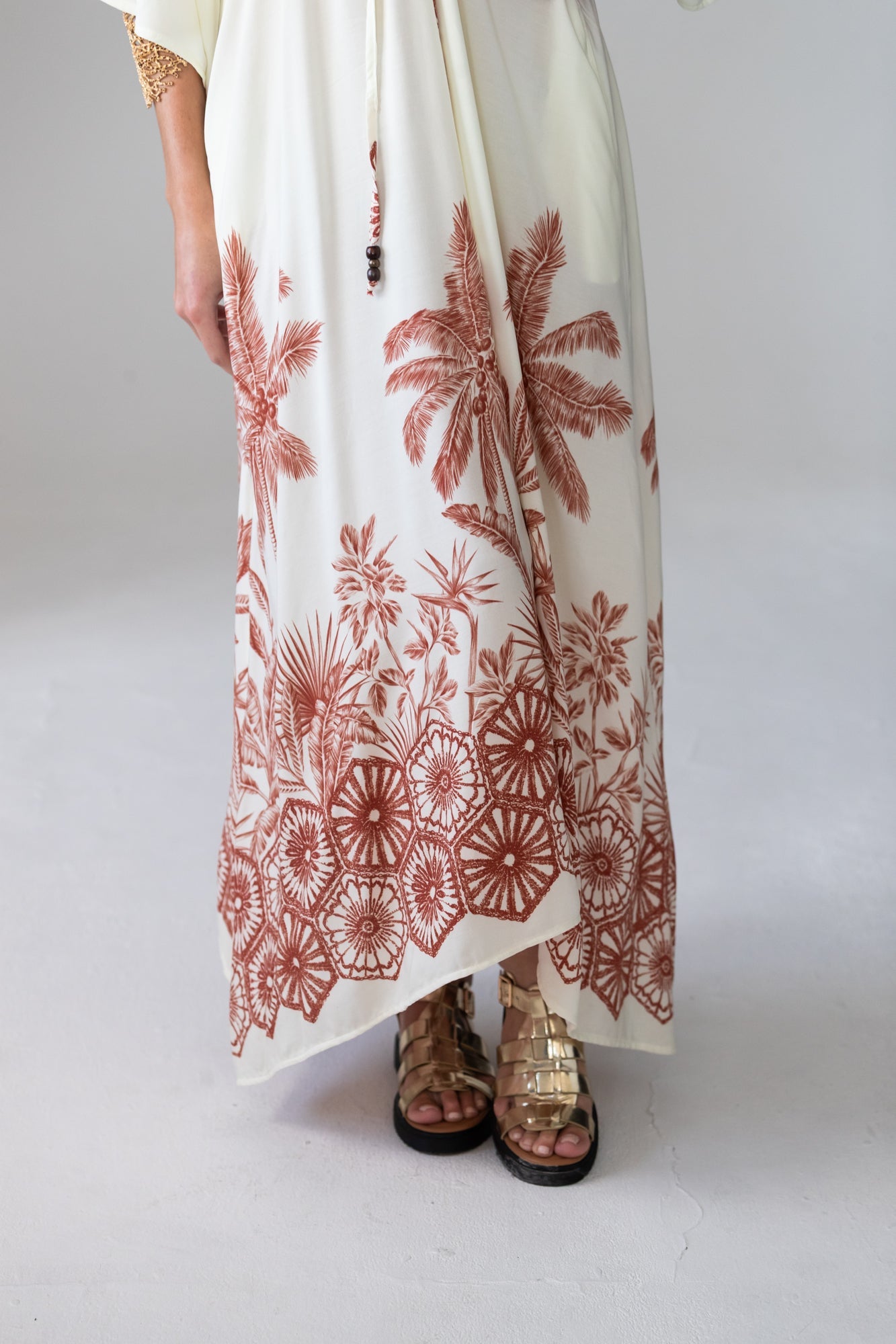 Georgia cream palm print kaftan, close up of hem showing palm border print