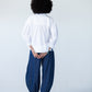 Blake white poplin shirt, back view with hands behind back