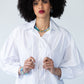 Blake white poplin shirt, close up front view with hands at placket