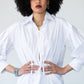 Blake white poplin shirt, front view with hands at waist