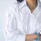 Blake white poplin shirt, close up of neckline with hands at collar