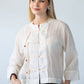 Amelia milk relaxed shirt, front view close up with toggle closures