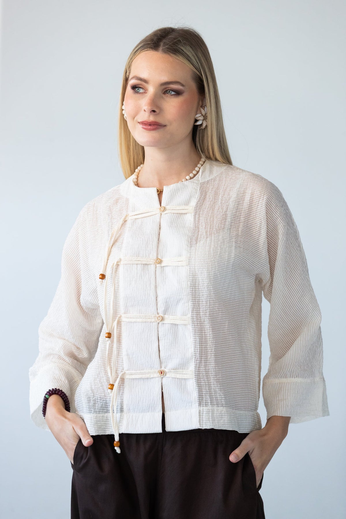 Amelia milk relaxed shirt, front view close up with toggle closures