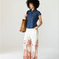 Sydney palm border wide leg pants, front view with hand in pocket